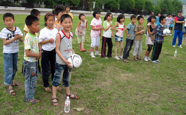 Children playing football in China